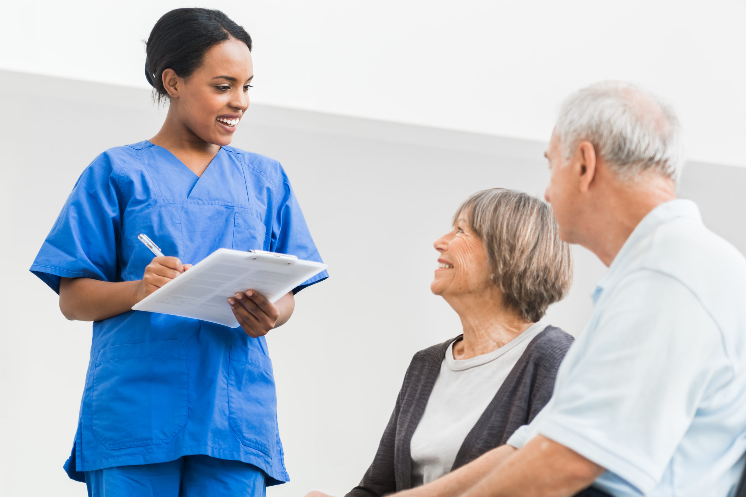 Nurse Welcomes Senior Couple in Hospital.