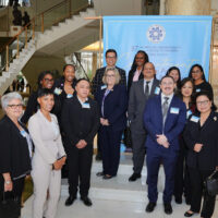 241017 Press Release - Dual Honors at the 37th Annual County Productivity and Quality Awards Group smiling in front of a sign for the Annual Productivity and Quality Awards